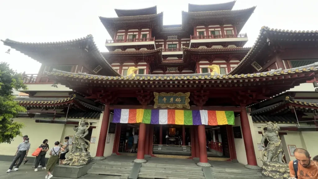 Colorful Singapore Chinatown shophouses with red lanterns and Little India Sri Veeramakaliamman Temple