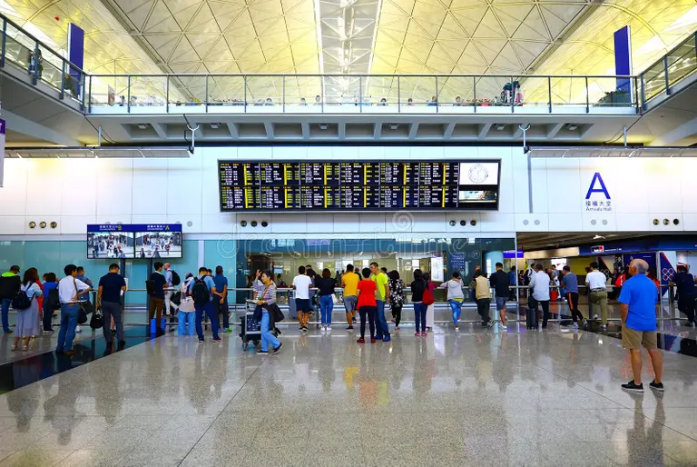 Hong Kong Macau itinerary day 1 showing Hong Kong International Airport arrival hall and city skyline